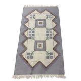 5FT 4IN X 2FT 11IN NEEDLEPOINT RUG.