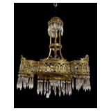 ANTIQUE BRASS AND CRYSTAL CHANDELIER