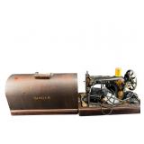 ANTIQUE SINGER MODEL 128 SEWING MACHINE WITH BEND
