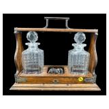ANTIQUE CRYSTAL AND OAK DECANTER TANTALUS SET