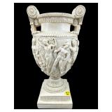 RESIN CARVED FIGURAL GRECIAN URN ON STAND