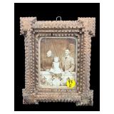 ANTIQUE TRAMP ART FRAME WITH PORTRAIT OF YOUNG