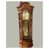 HOWARD MILLER OAK TALL CURIO CLOCK