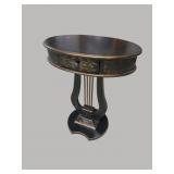 EBONIZED GOLD DECORATED LYRE BASE OVAL TABLE