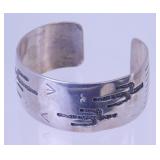 T.A. Begay Sterling Bracelet with Native Design -