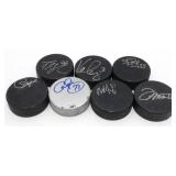 7 Signed Hockey Pucks