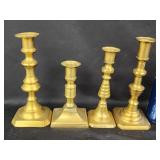 4 Brass candlesticks.  Look at the photos for