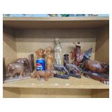 Lot of Asian and African wood carvings.