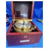 Hamilton Quartz clocking in wood and brass gimbal