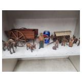 European wood carvings of people,  hunting dogs,