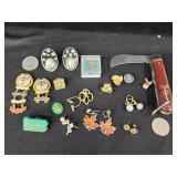 Pocket knife. Earrings. Cross. Church pins. Pa