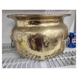 Brass planter with lion base handles.  9.5" H .