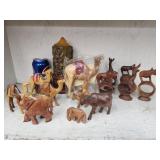 Wood carved camel, elephants and 5 figural napkin
