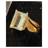 14 K gold ring with square cut center Aqua stone.