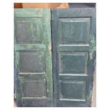 Pair of early solid raised panel shutters look at