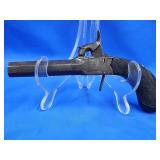 Antique pocket pistol with hidden trigger.