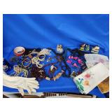 Bead necklaces. Wood bracelets. Pins. Scarves,