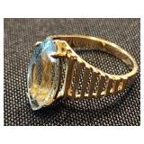 10 K ring with Marquis style Topaz stones.