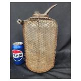 Glass and wire mesh Kerosene oil jug. Has wire