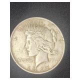 1922 Silver Peace Dollar coin.   Look at the