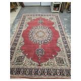 Oriental style rug with medallion center measures
