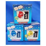 3 M & M Saltband pepper shakers.   Still in box