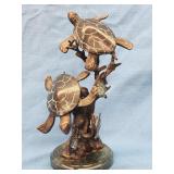 Sea Turtle Sculpture on green marble base.