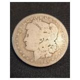 1884 Morgan Silver Dollar coin .  Look at the