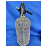 Vintage soda siphon  14" H.  Wire mesh wrap.