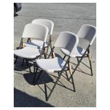 4 plastic folding chairs like new condition look