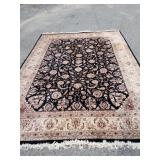 Wool rug noir ground floral design.  Oriental