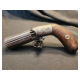 Pepperbox pistol under hammer 6 barrel.