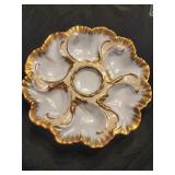 Oyster plate trimmed in gold paint.  Marked