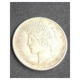 1928 Silver Peace Dollar coin.   Look at the