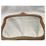 Beveled Oak frame  mirror off a high chest or