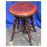 Mahogany piano stool  glass ball with metal claw
