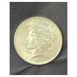1928 Silver Peace Dollar coin.  Look at the