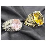 2 Sterling silver rings with colored stones.