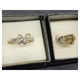 2 Sterling silver rings.  Criss Cross band and 1