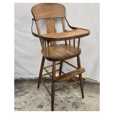 Antique Highchair with flip tray and has foot