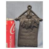 Cast Iron Match Holder with fliral top on a note