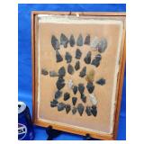 36 Arrowheads and points in display case.