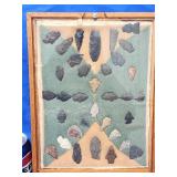 34 Arrowheads and points arranged in display.