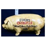 Cast iron Fincks Overalls pig bank