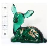 Fenton green laying deer with gold leaves