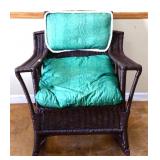 Painted brown wicker rocker w/ green cushions