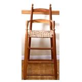Primitive wooden woven bottom youth chair
