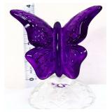 Fenton amethyst butterfly on clear branch