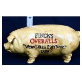 Cast iron Fincks Overalls pig bank