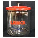 Round glass Lance jar w/ red metal lid